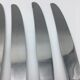12 silver metal knives.
