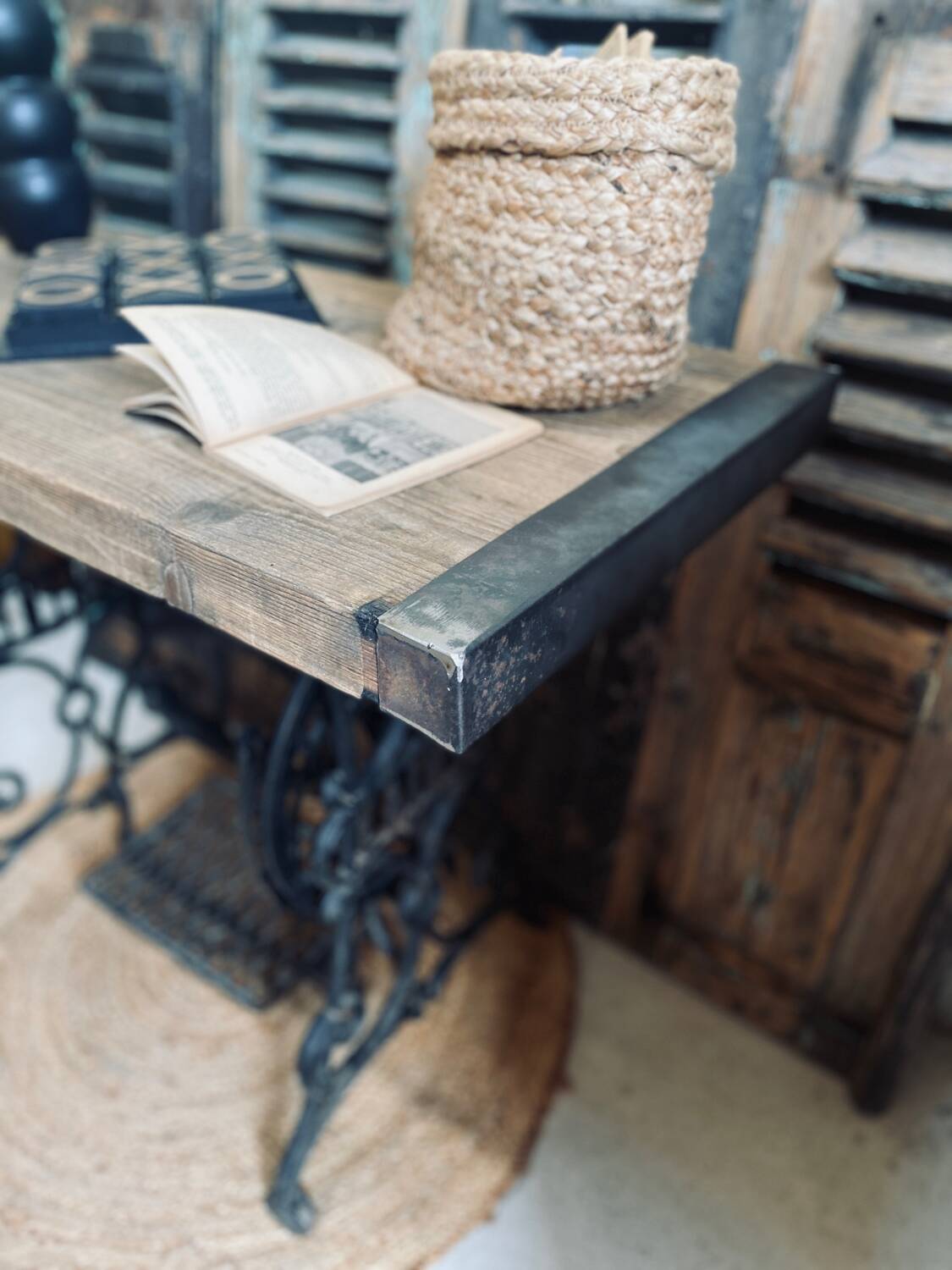 Vintage wooden table with a cast iron base.