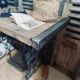 Vintage wooden table with a cast iron base.