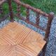 Pair of angled armchairs with turned wood and rush seats from the 1960s.