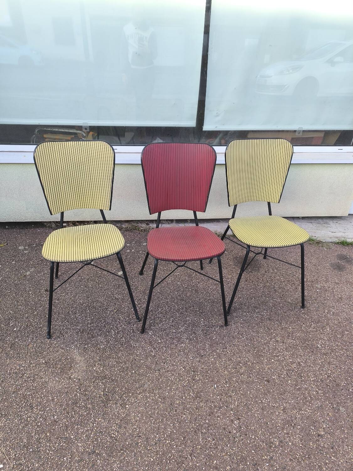 Set of 3 vintage yellow and red faux leather chairs.