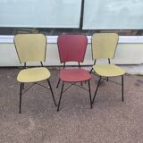 Set of 3 vintage yellow and red faux leather chairs.