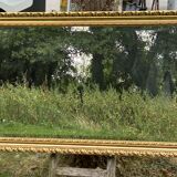 Large beveled mirror in wood and gilded stucco