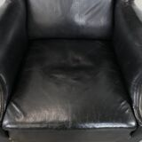 Antique black English cow leather wingback armchair from the 19th century