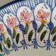 Hand-painted earthenware plate, floral bouquet