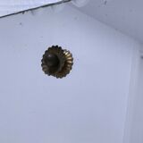 Octagonal mirror with brass hubcaps from the 60s