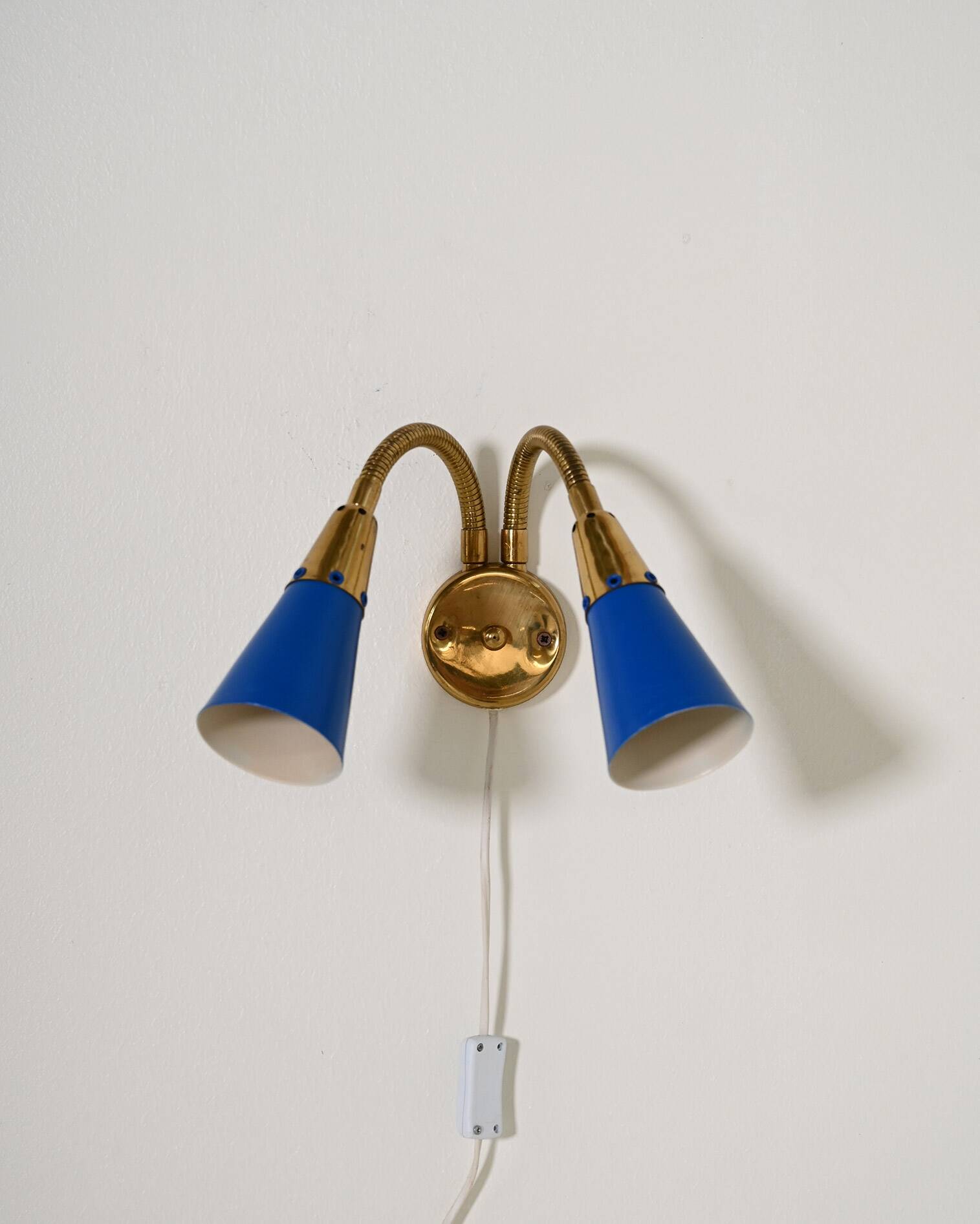 Adjustable brass and lacquered metal wall lamp, Scandinavia, 1960s