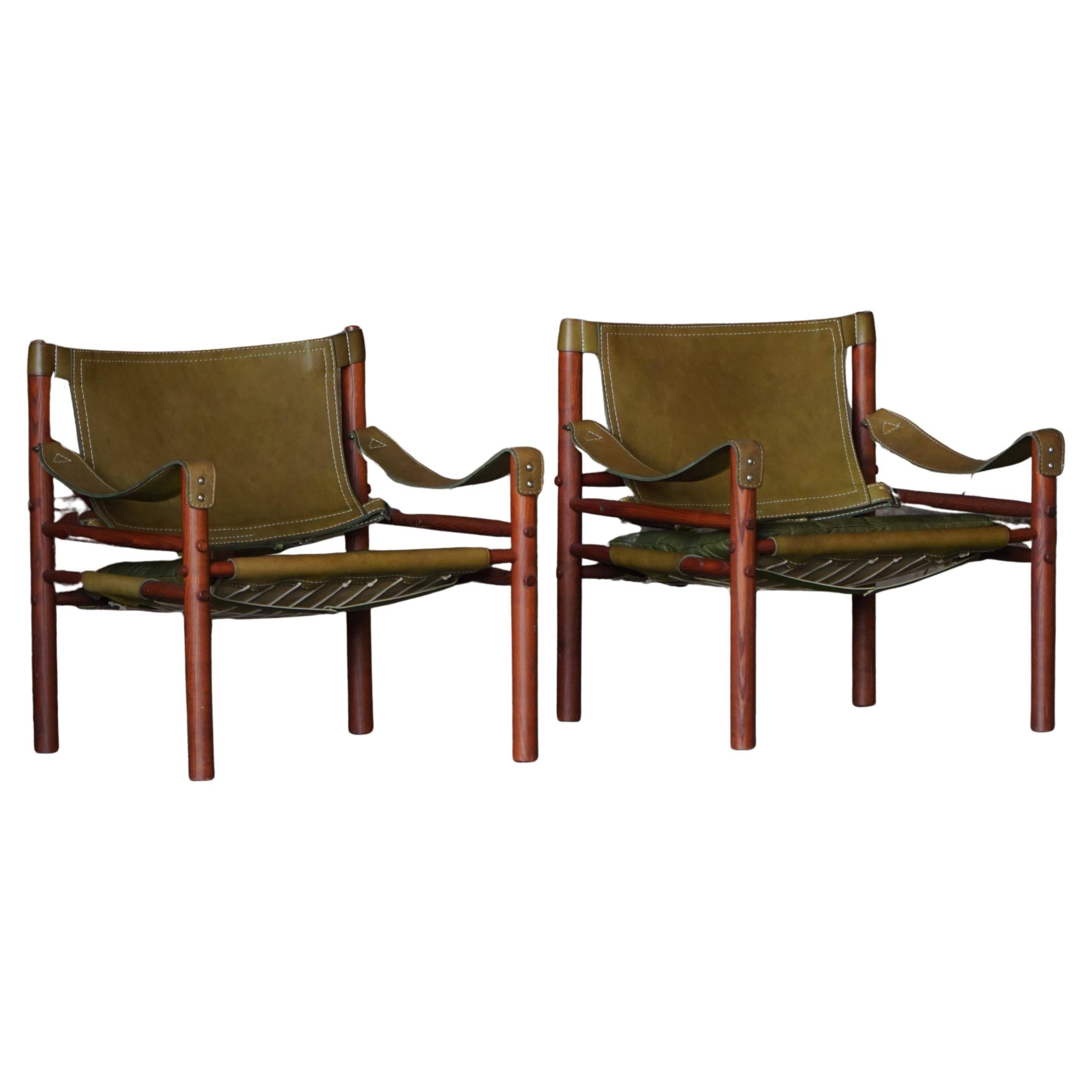Arne Norell, Pair of "Sirocco" Safari armchairs in ash and green leather, 1960s.