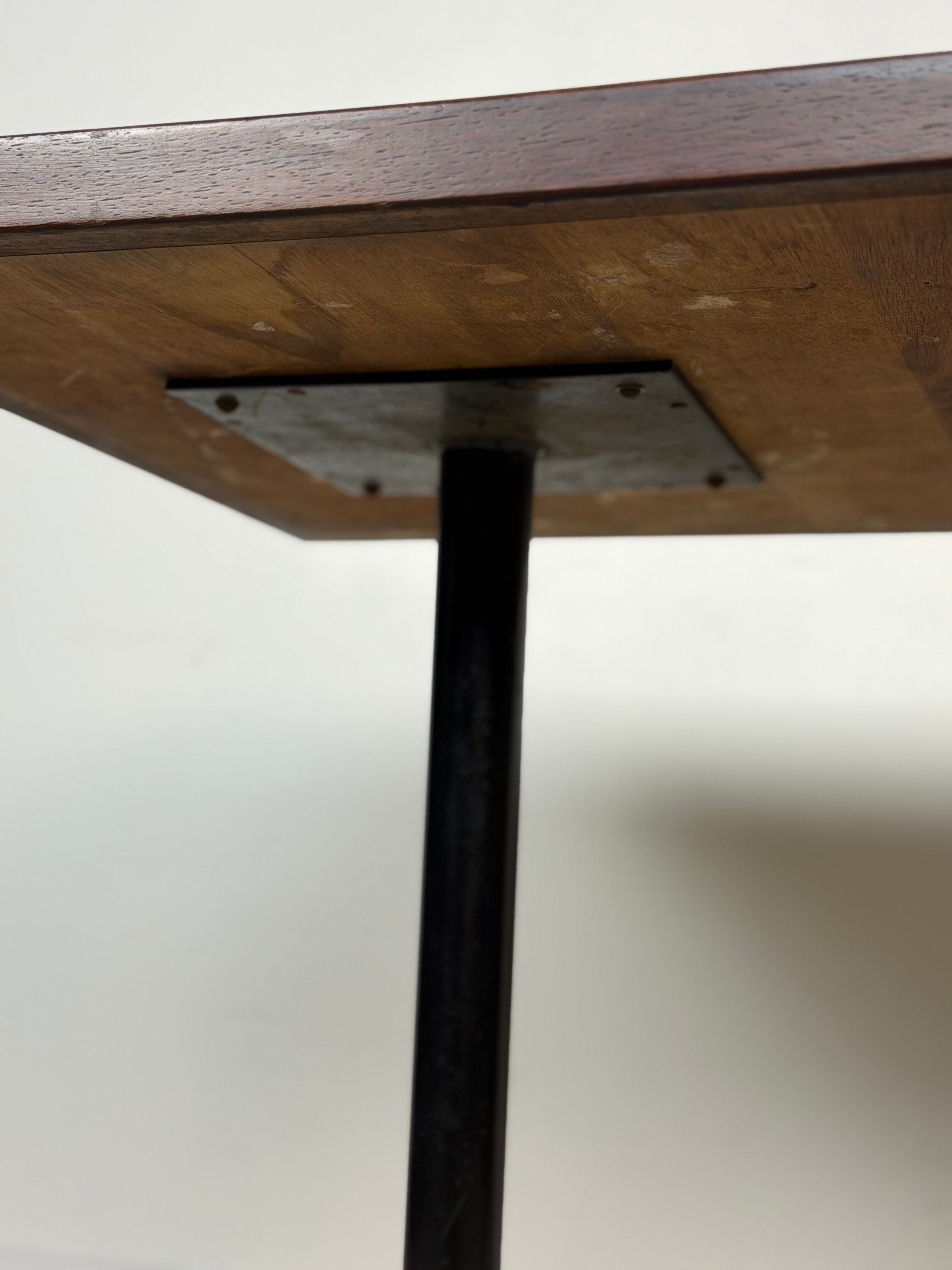 Vintage bistro table with orange-red ceramic.