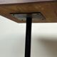 Vintage bistro table with orange-red ceramic.