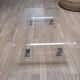 Design coffee table from Habitat in transparent plexiglass, mounted on wheels.