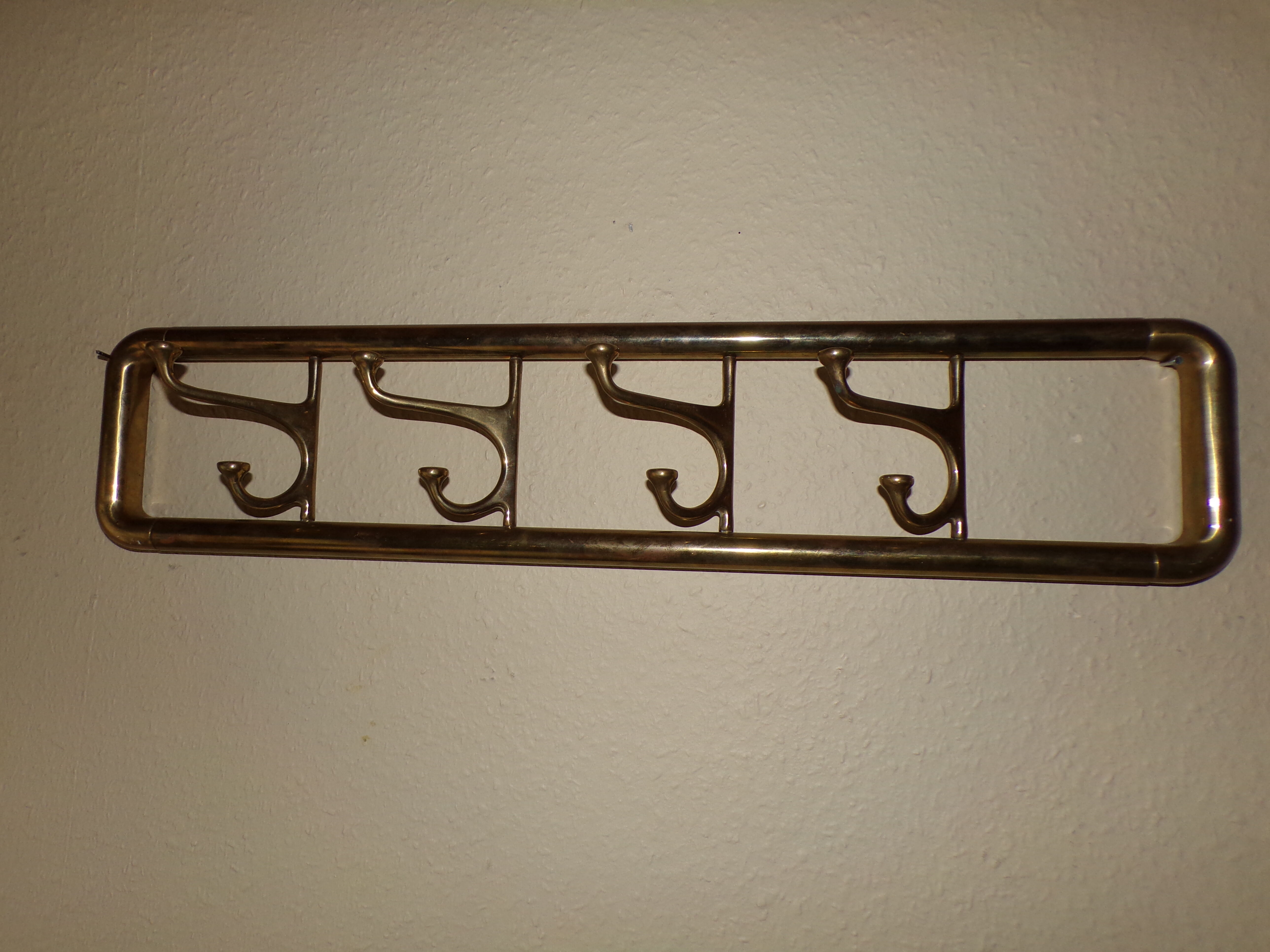 Brass wall coat holder