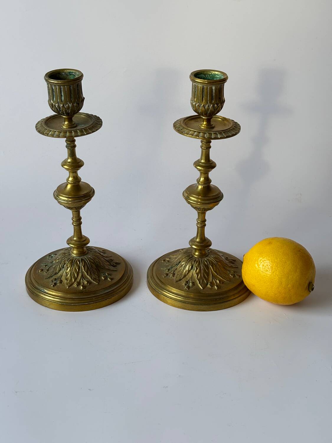 Pair of neoclassical brass candlesticks