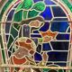 Stained glass panel representing a nineteenth century coronation