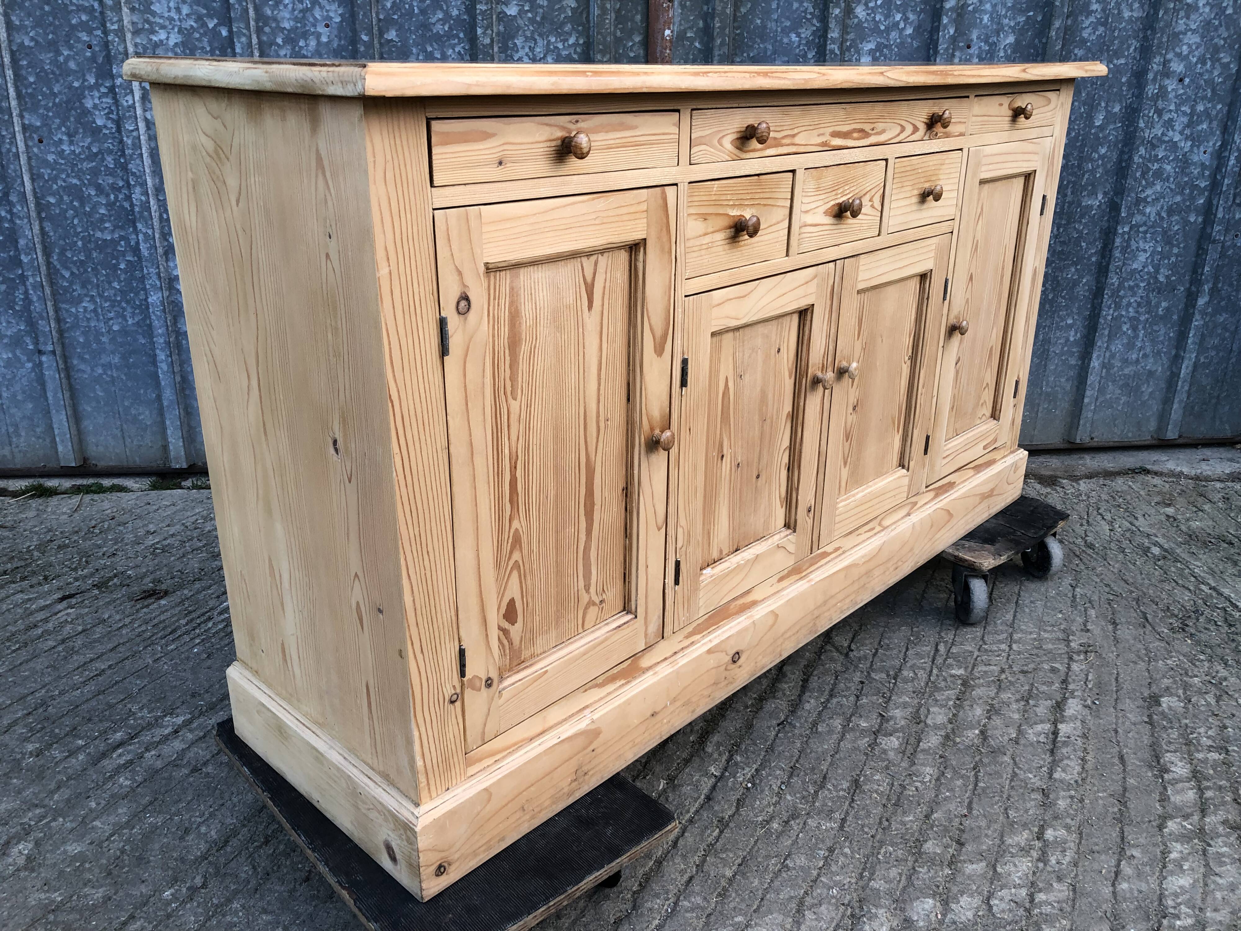 Scandinavian natural pine sideboard with 4 doors and 6 drawers.