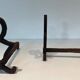 Pair of Modernist Andirons in Cast Iron with Stylised Figure Supports, by Ray