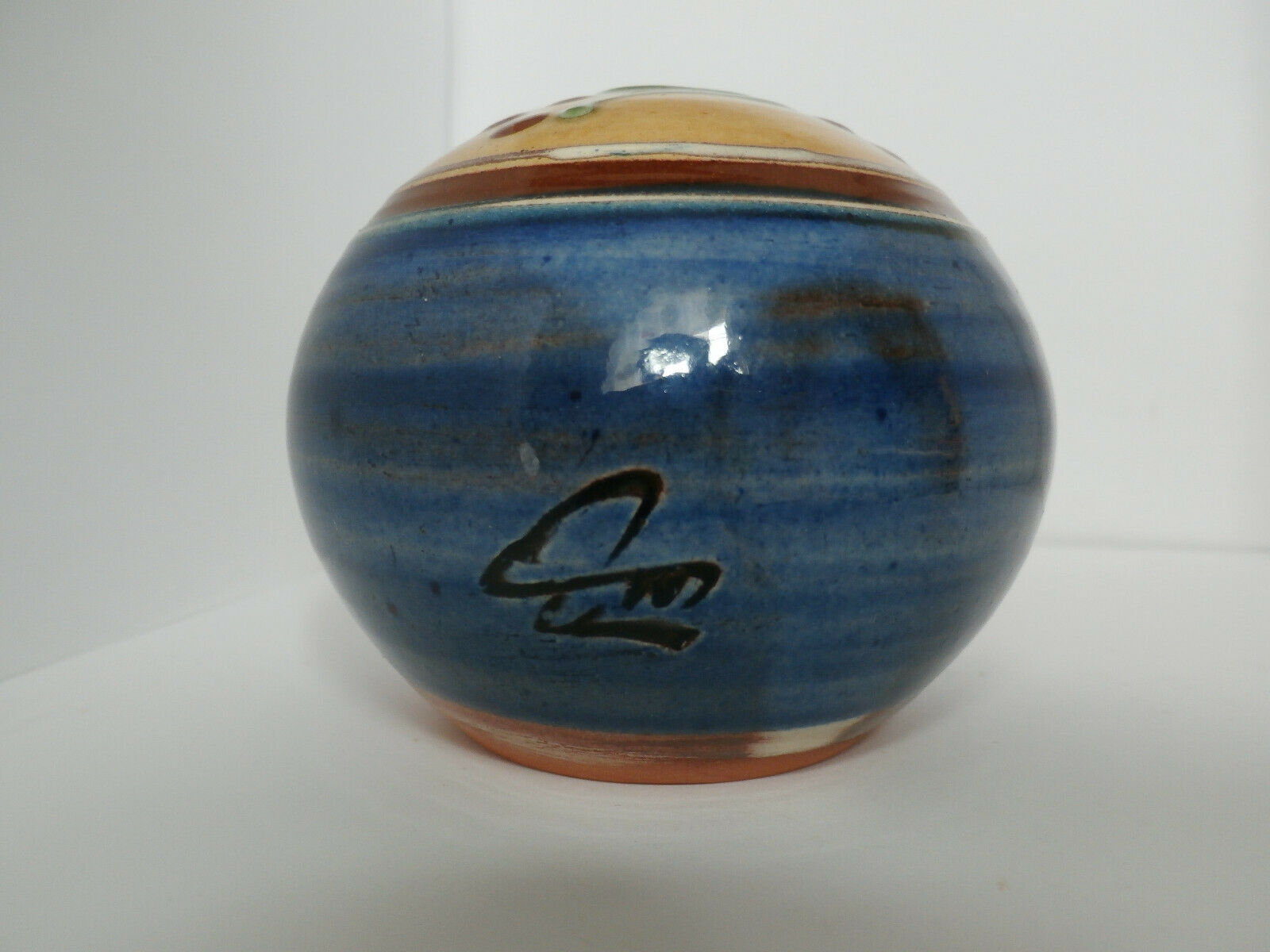Glazed terracotta ball signed Otto Lindner
