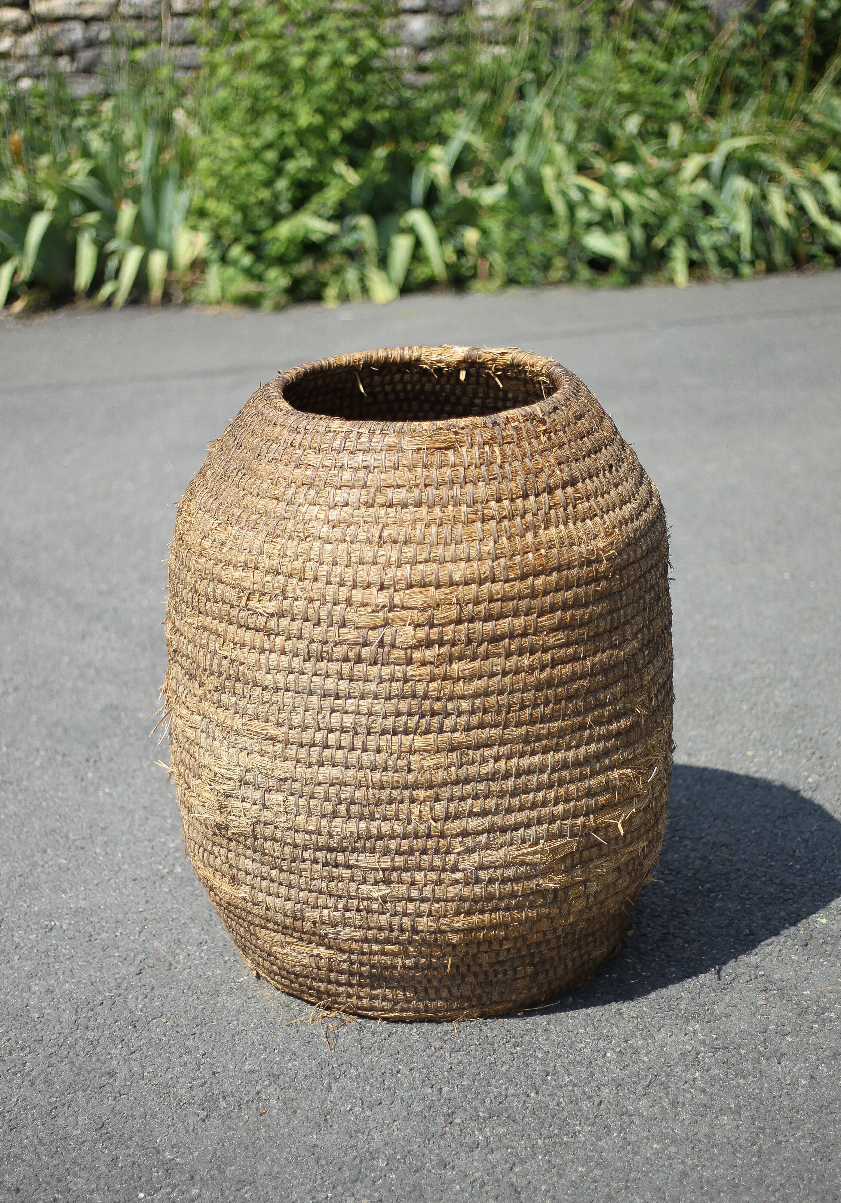 Very large old basket, burgundy straw and bramble, woven basket