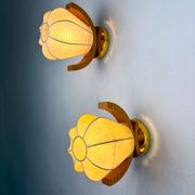Pair of pear-shaped "Cocoon" wall sconces, resin and pine wood, Italy, 1970s