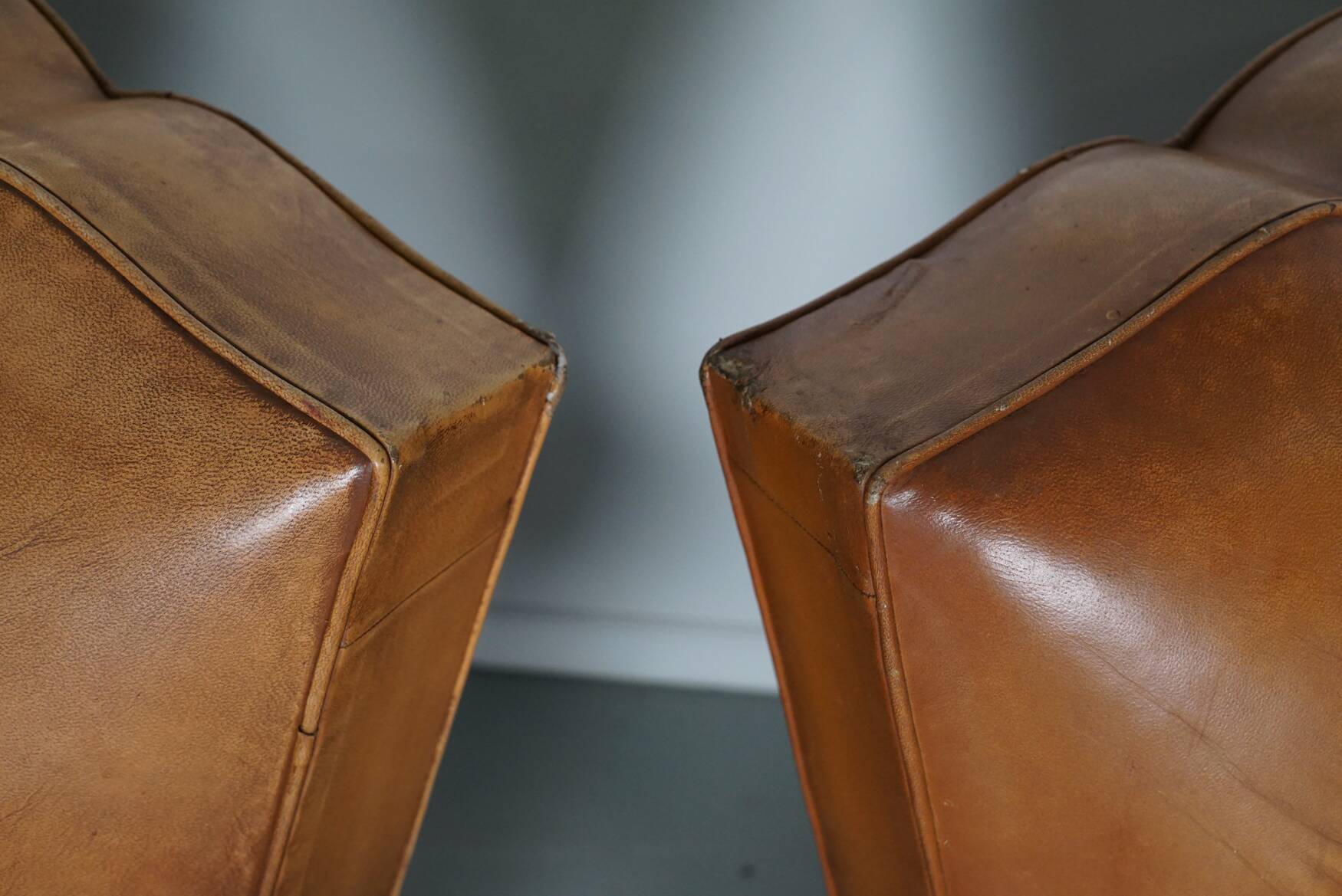 Pair of French Cognac Moustache Back Leather Club Chairs, 1950s