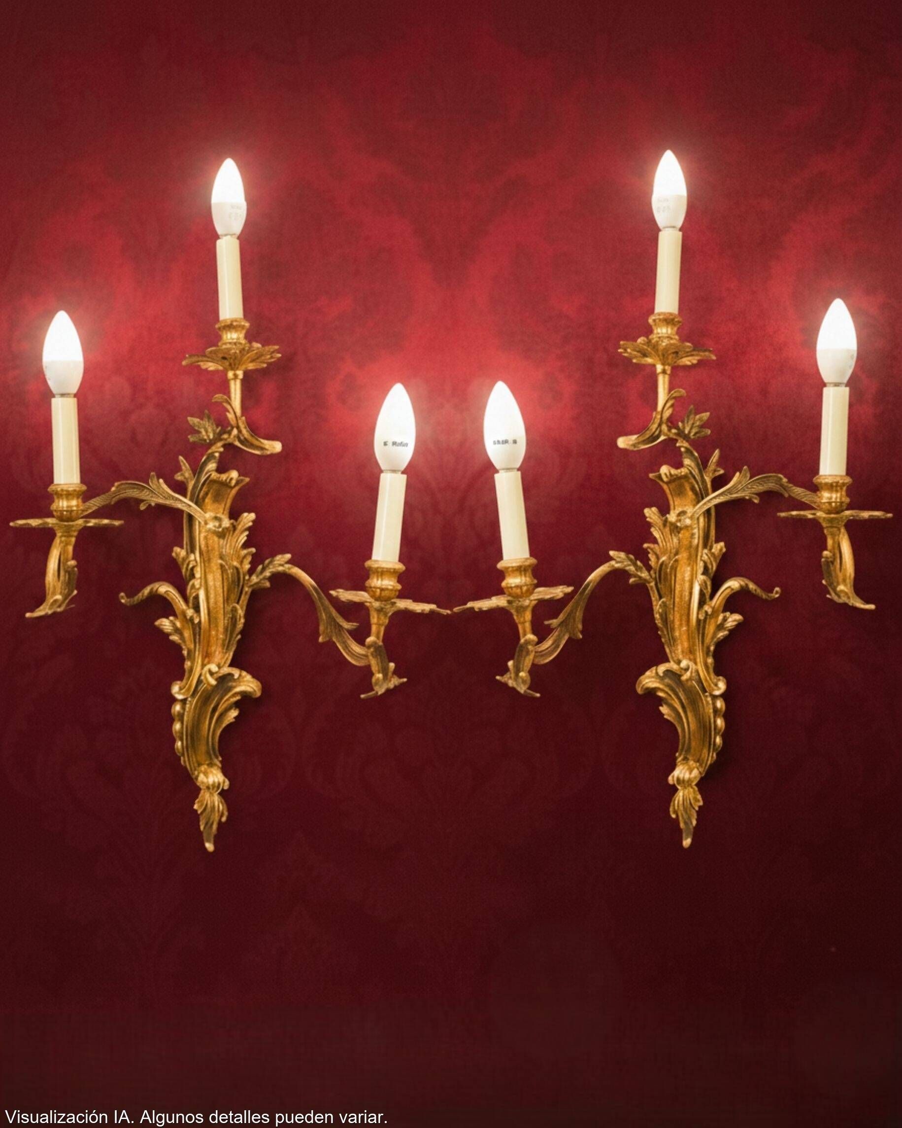 Pair of gilded bronze wall sconces in Rococo style, three lights.