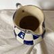 Antique blue and white checkered pitcher