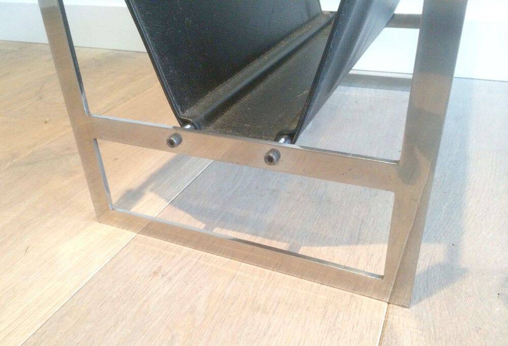 Magazine rack in brushed steel and leather, in the style of Poul Kjaerholm