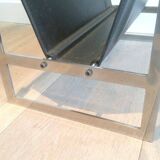 Magazine rack in brushed steel and leather, in the style of Poul Kjaerholm