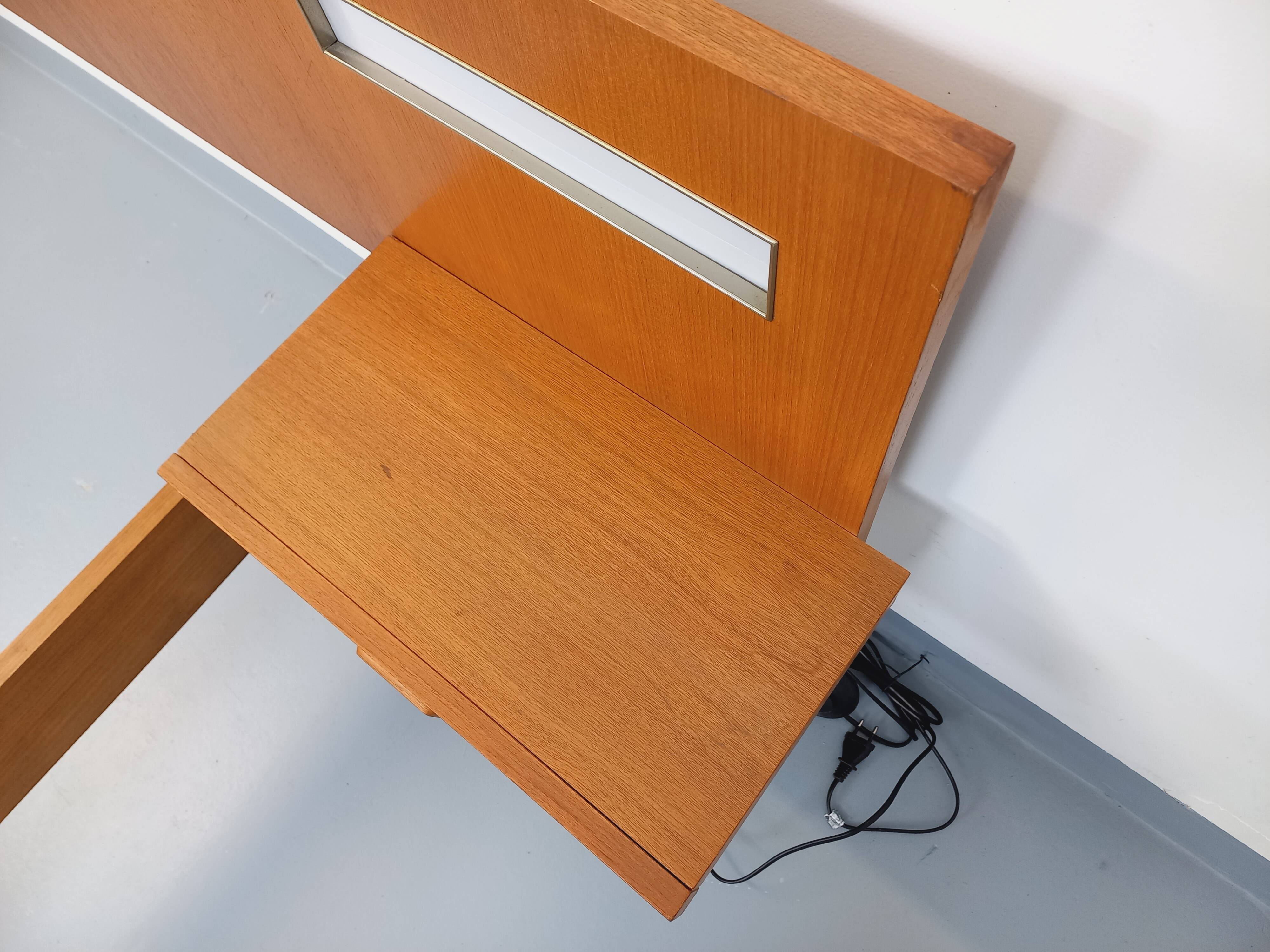 Double bed in vintage Scandinavian style from the 1960s with bedside tables.