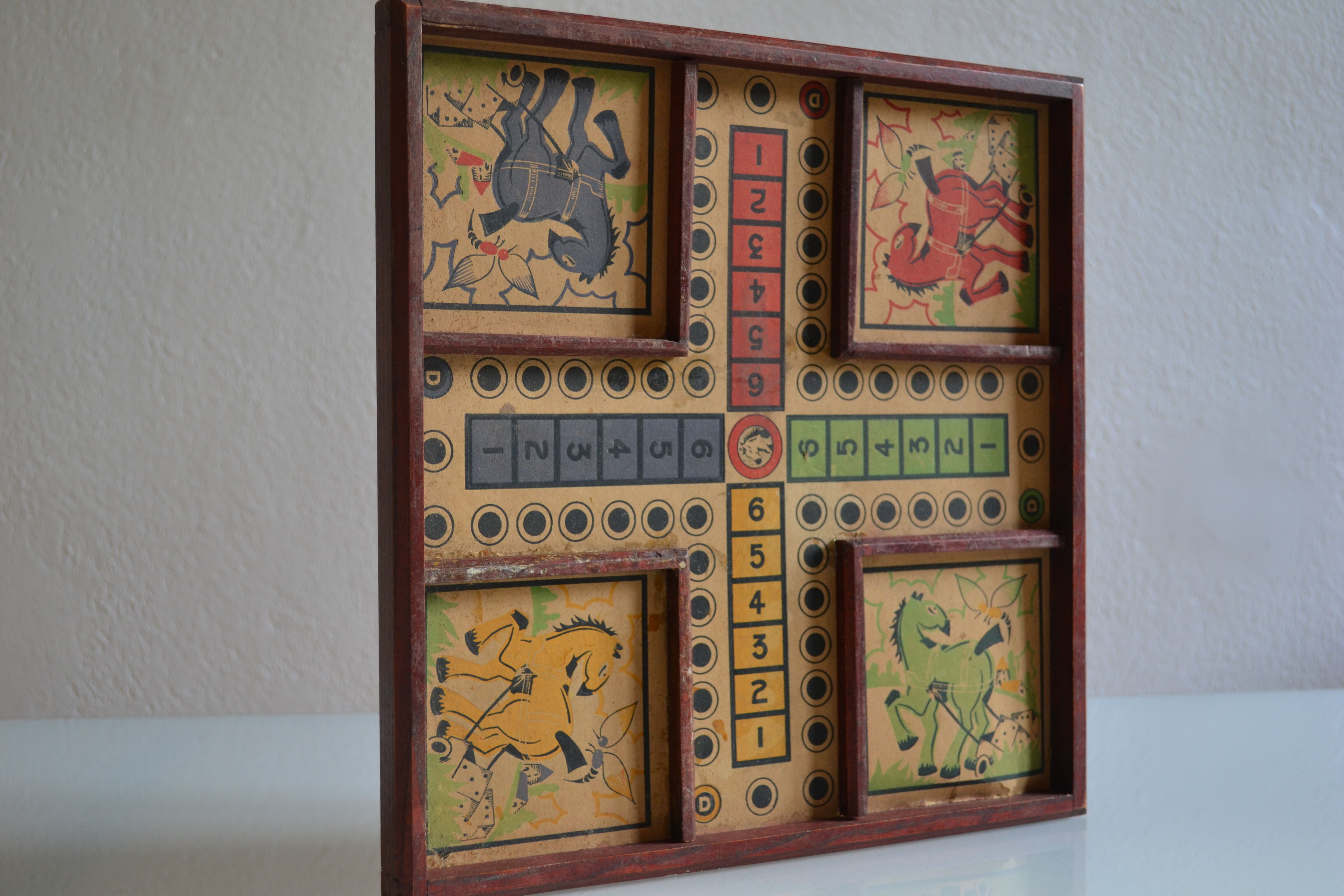 Old game board of small horses
