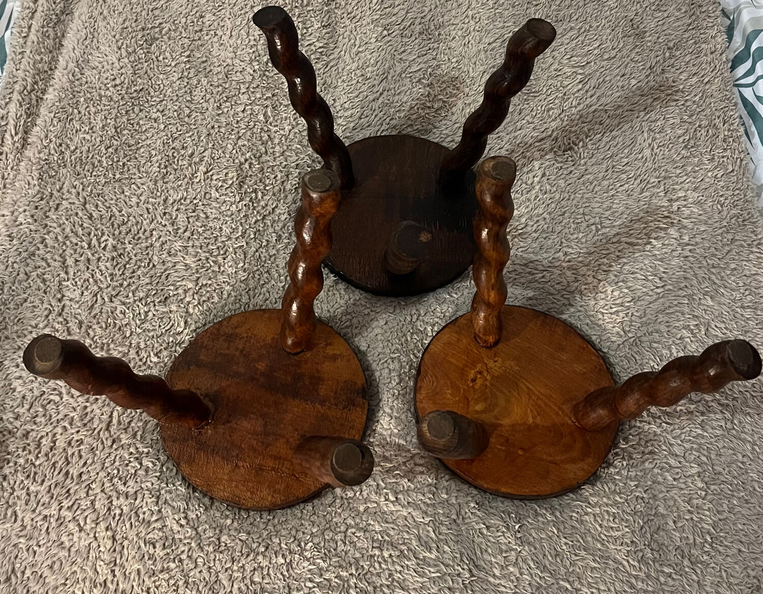 Wooden tripod stool with twisted legs