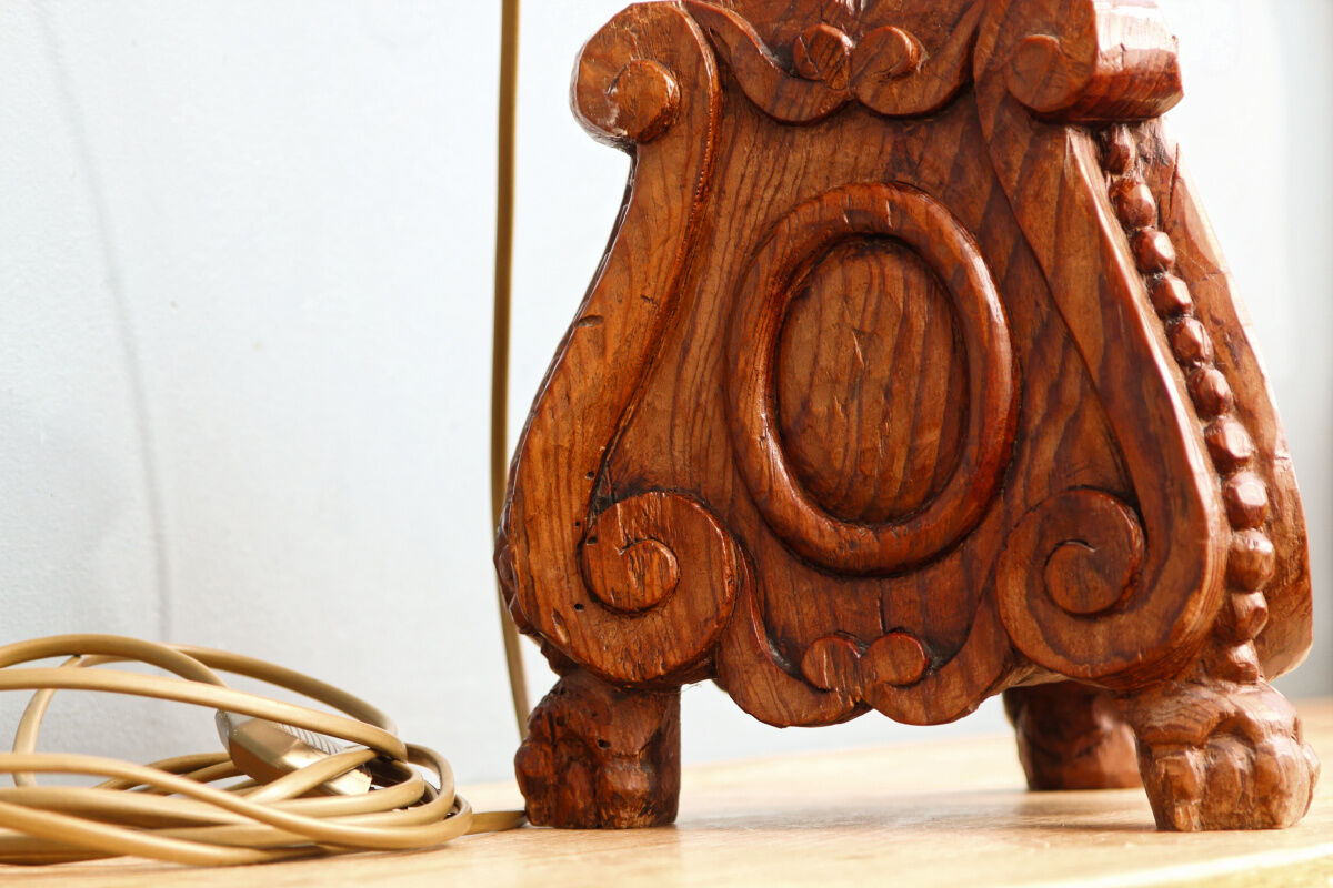 Carved wooden lamp, fiber shade