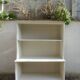 Vintage library enhanced in beige, wooden top.