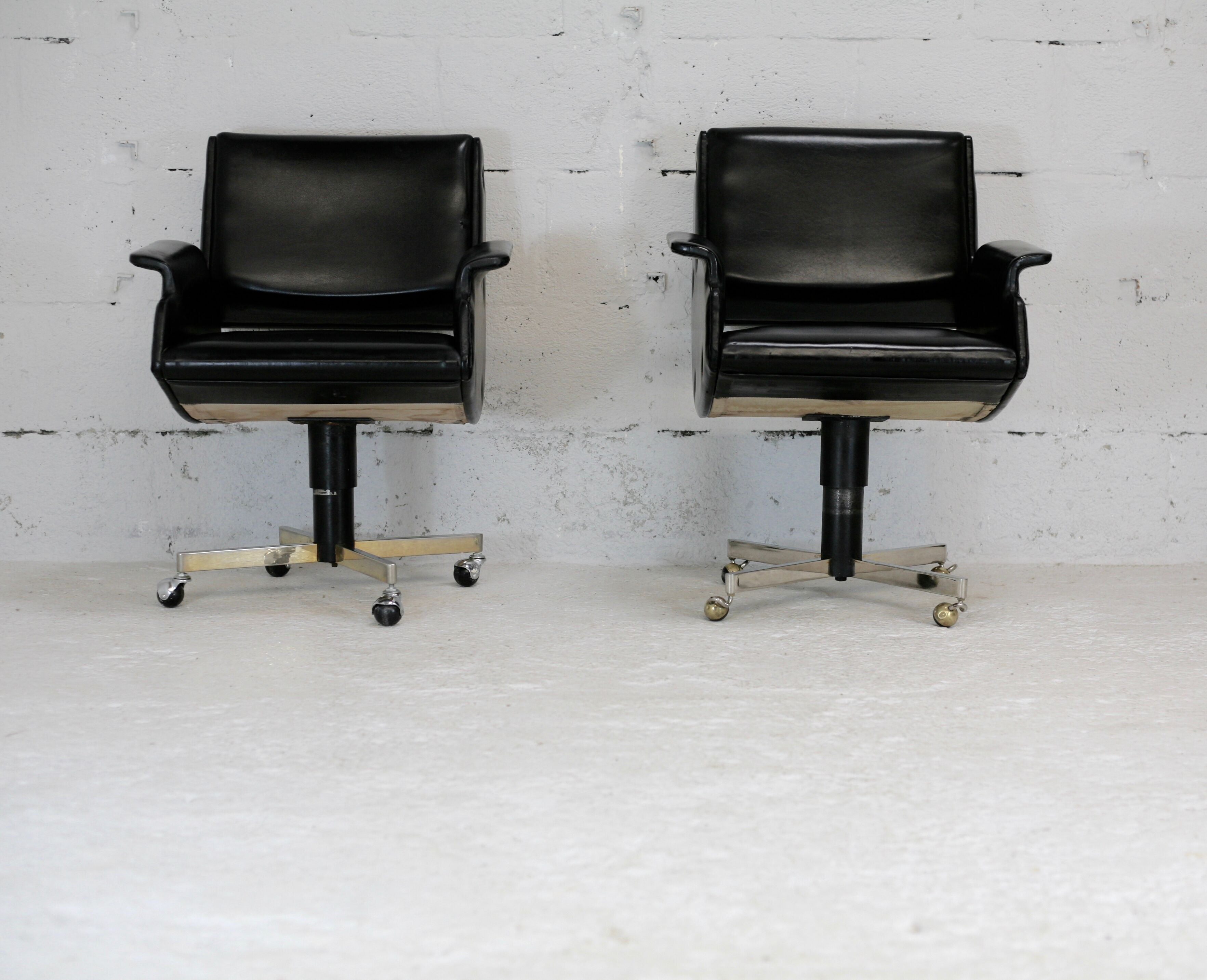 Pair of swivel armchairs, imitation leather and steel, Italy, circa 1960.