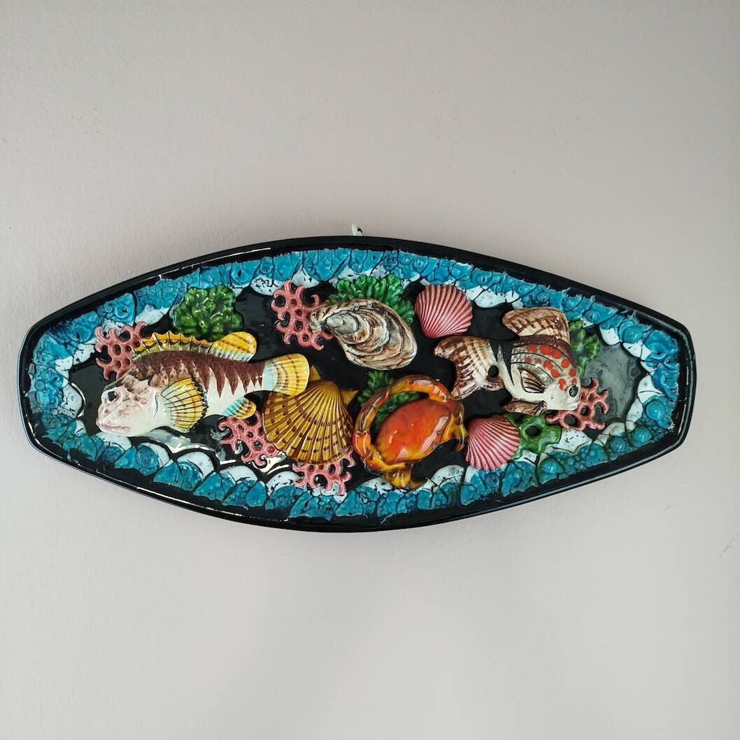 Dish with fish and shells relief decoration