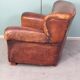 Leather nailed armchair