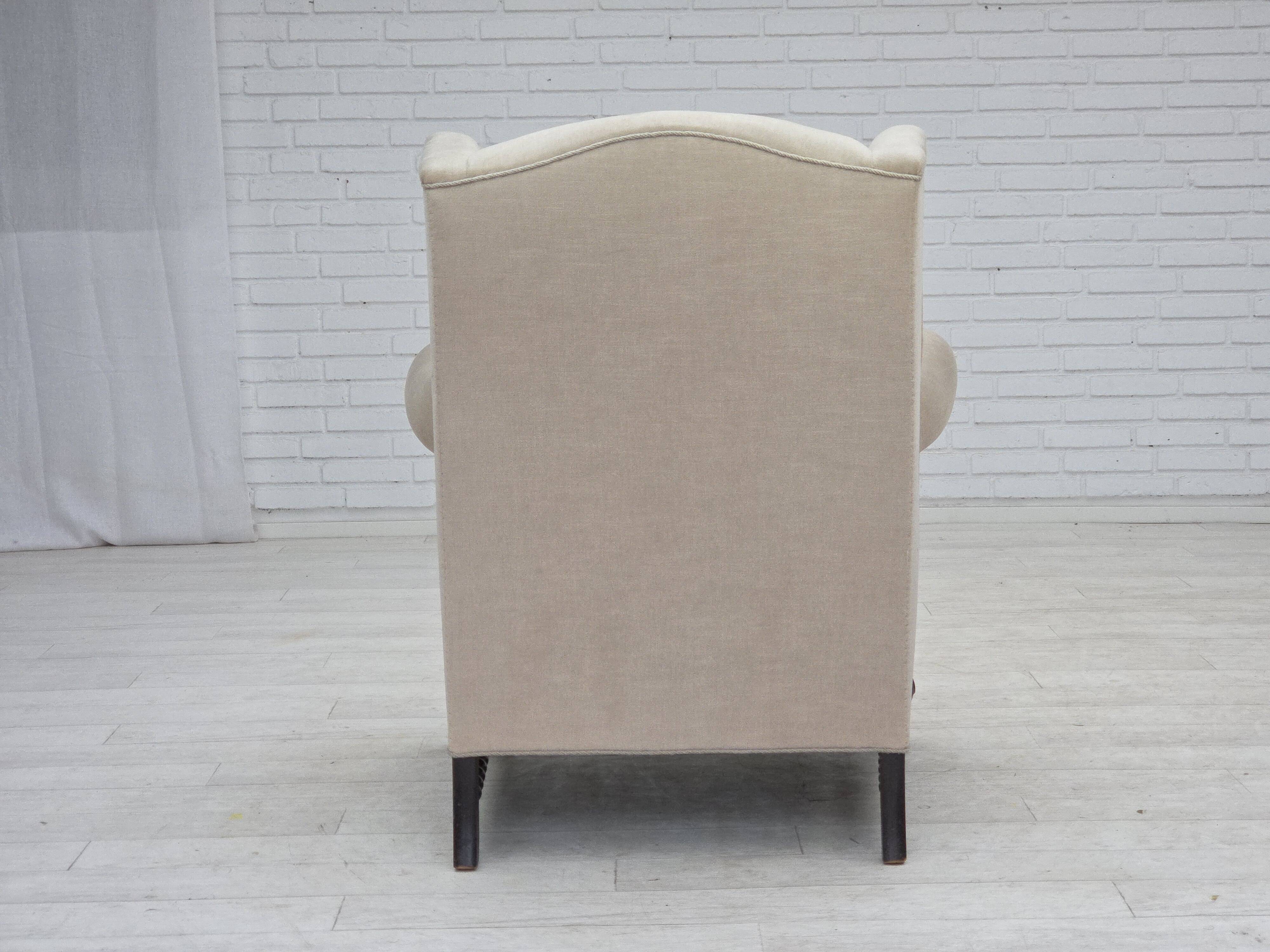 1960s, Danish wingback armchair, furniture velour, carved oak wood.