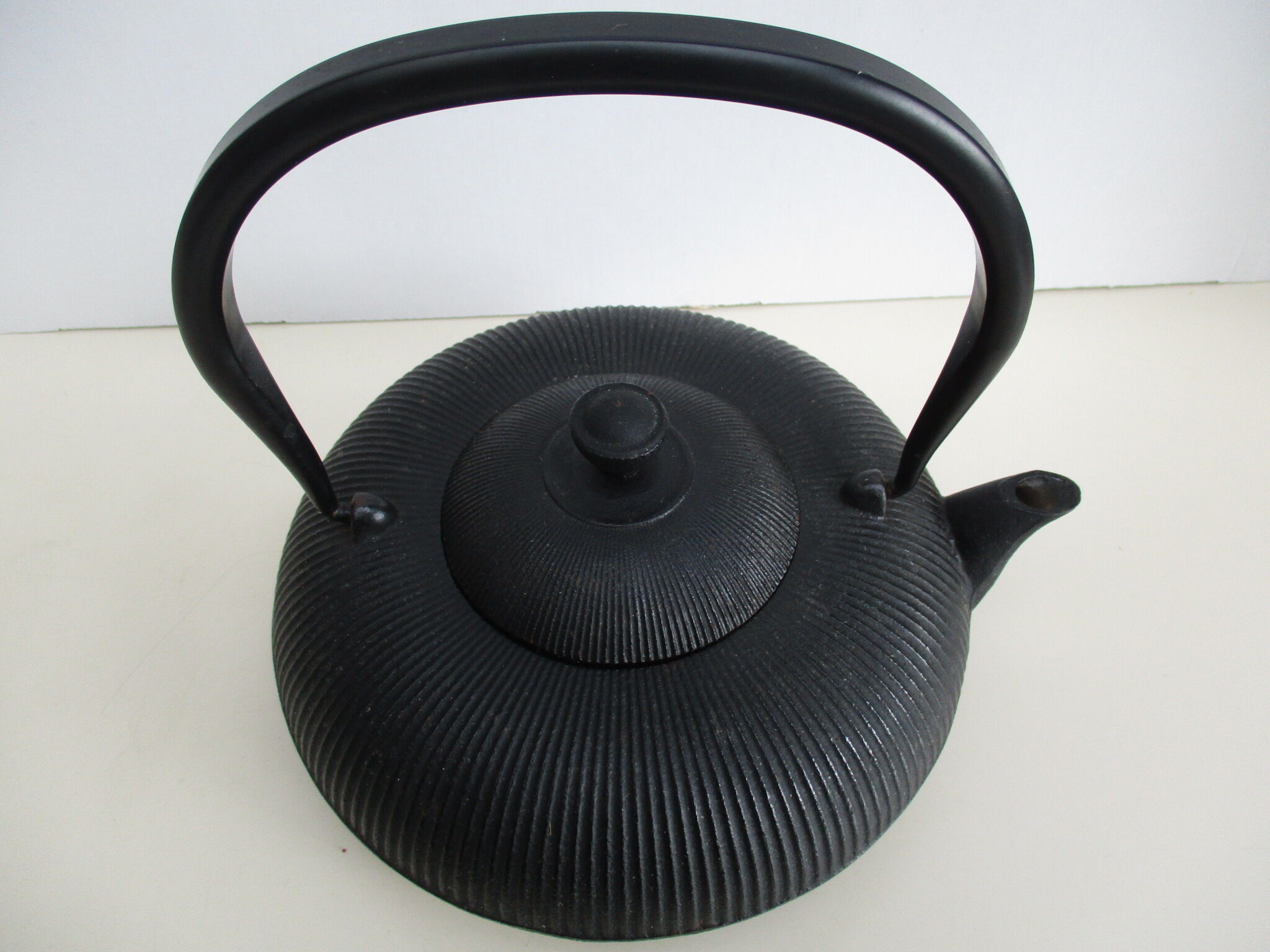 Asian teapot in black cast iron