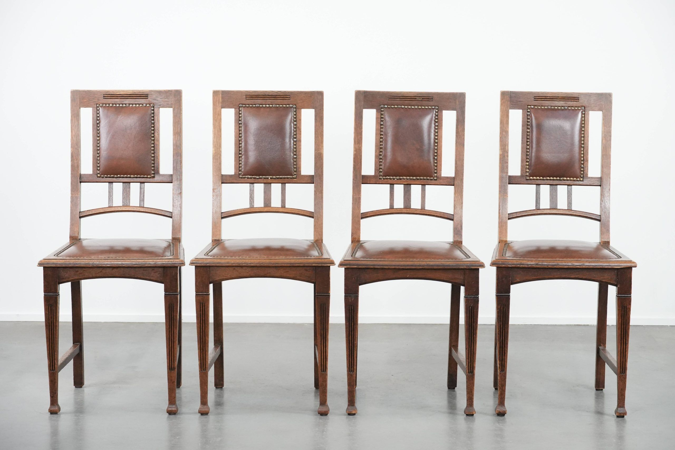 Set of four antique oak dining chairs in Art Nouveau style