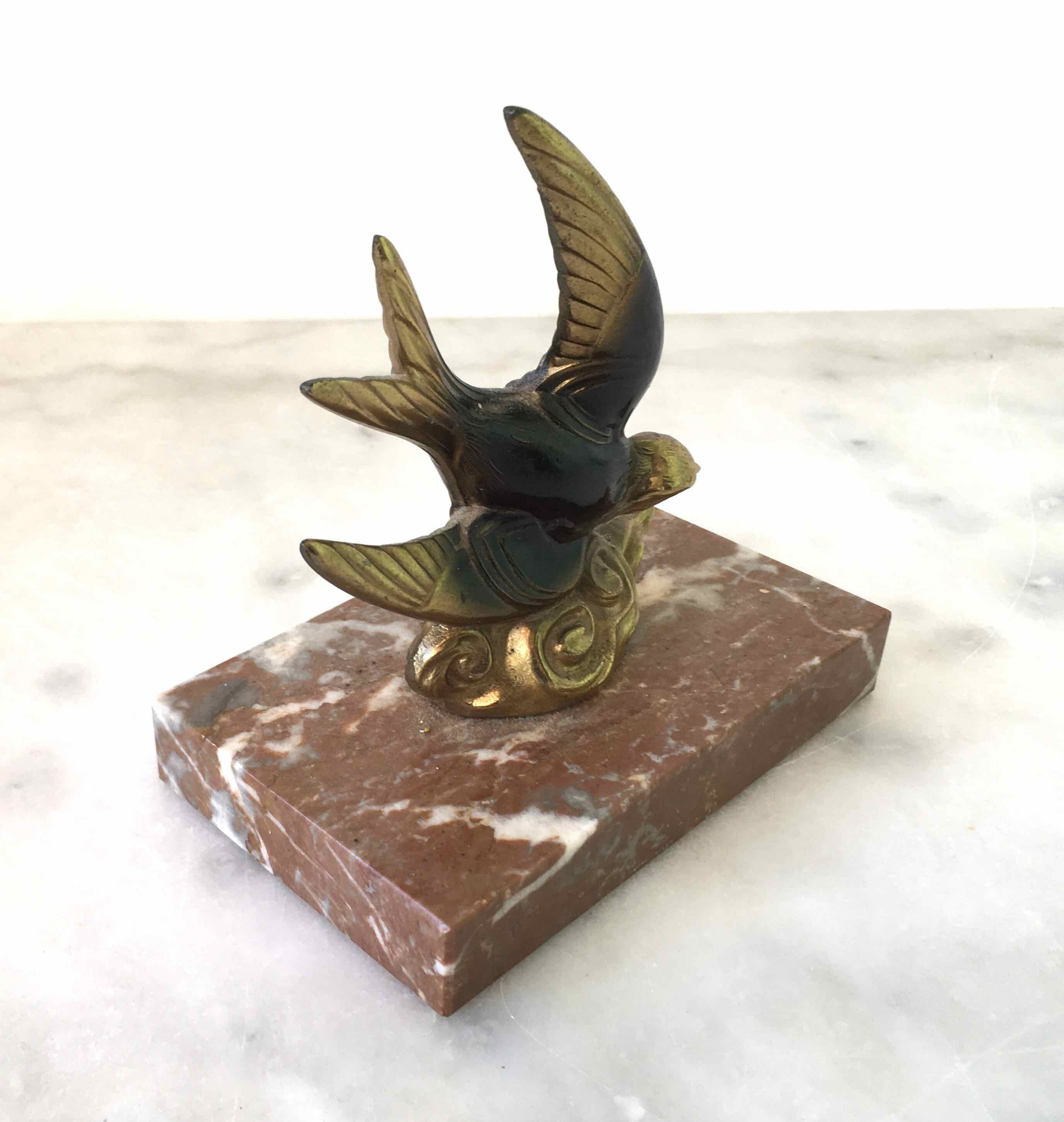 Marble swallow and brass paperweight