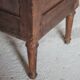 Antique wooden corner cabinet with a curved door.