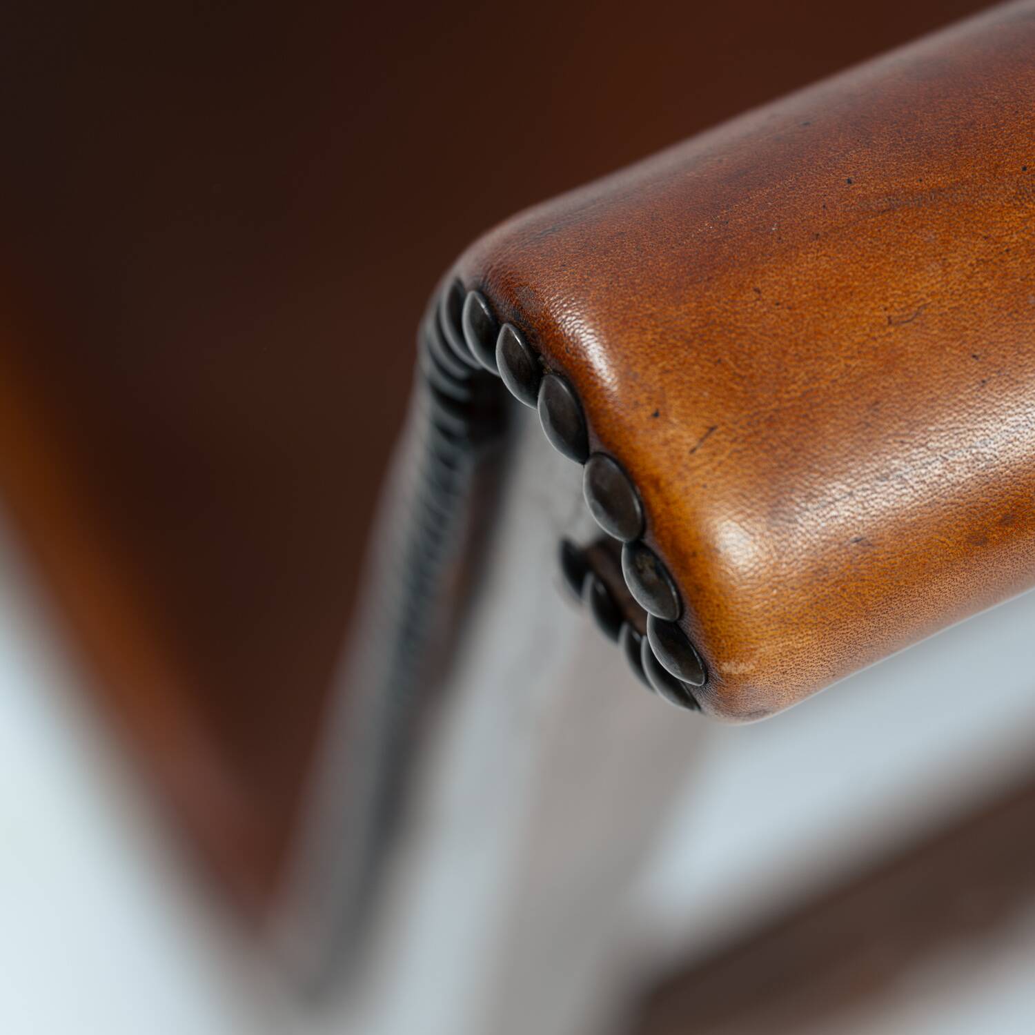 Pierre Lottier brown Spanish leather Slipper chairs by Almazan, 1950s