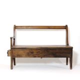 Handcrafted wooden bench with armrest and drawer on the right.