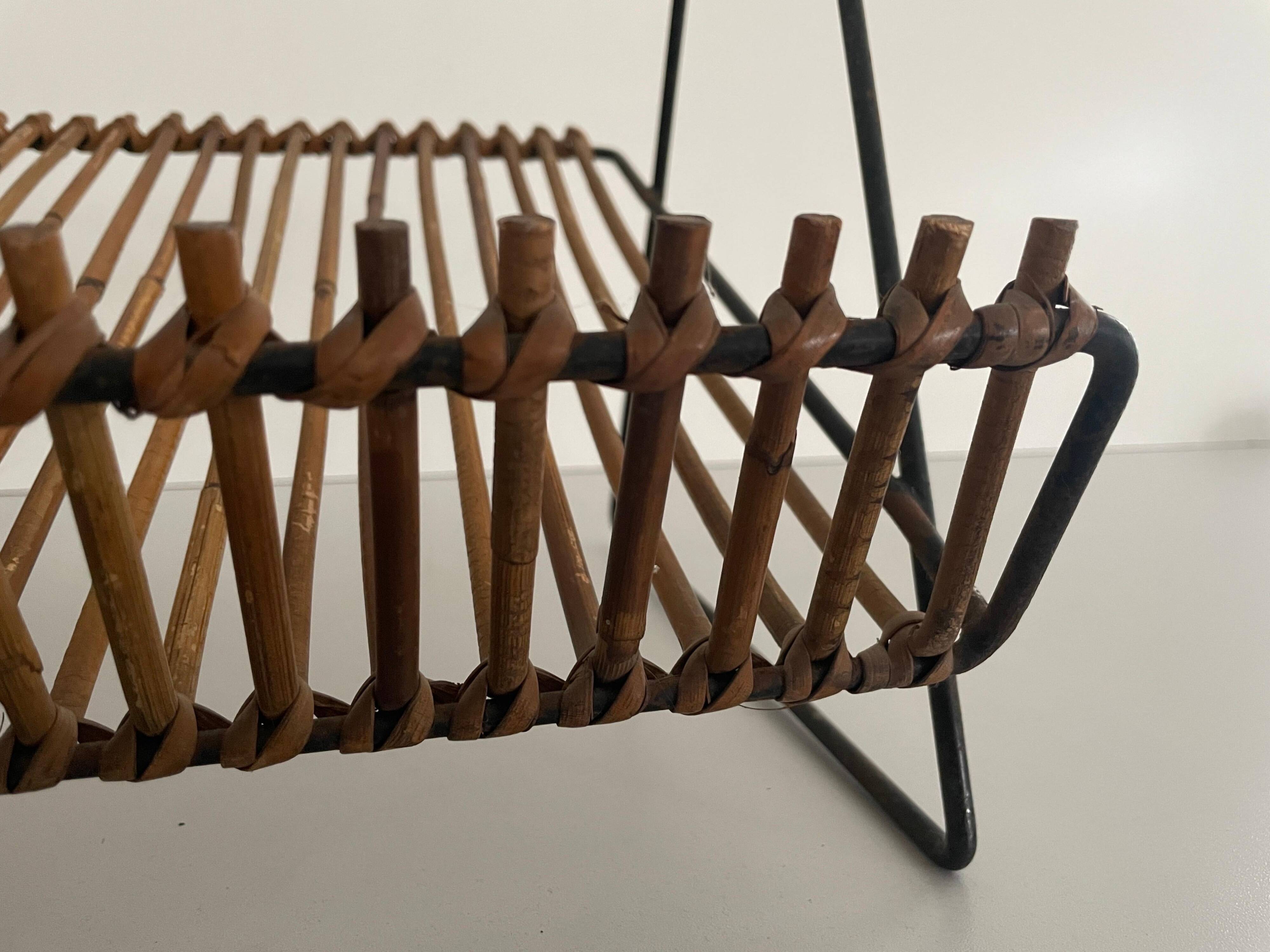 Mid-century black metal and rattan magazine rack, 1960, Italy