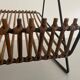 Mid-century black metal and rattan magazine rack, 1960, Italy