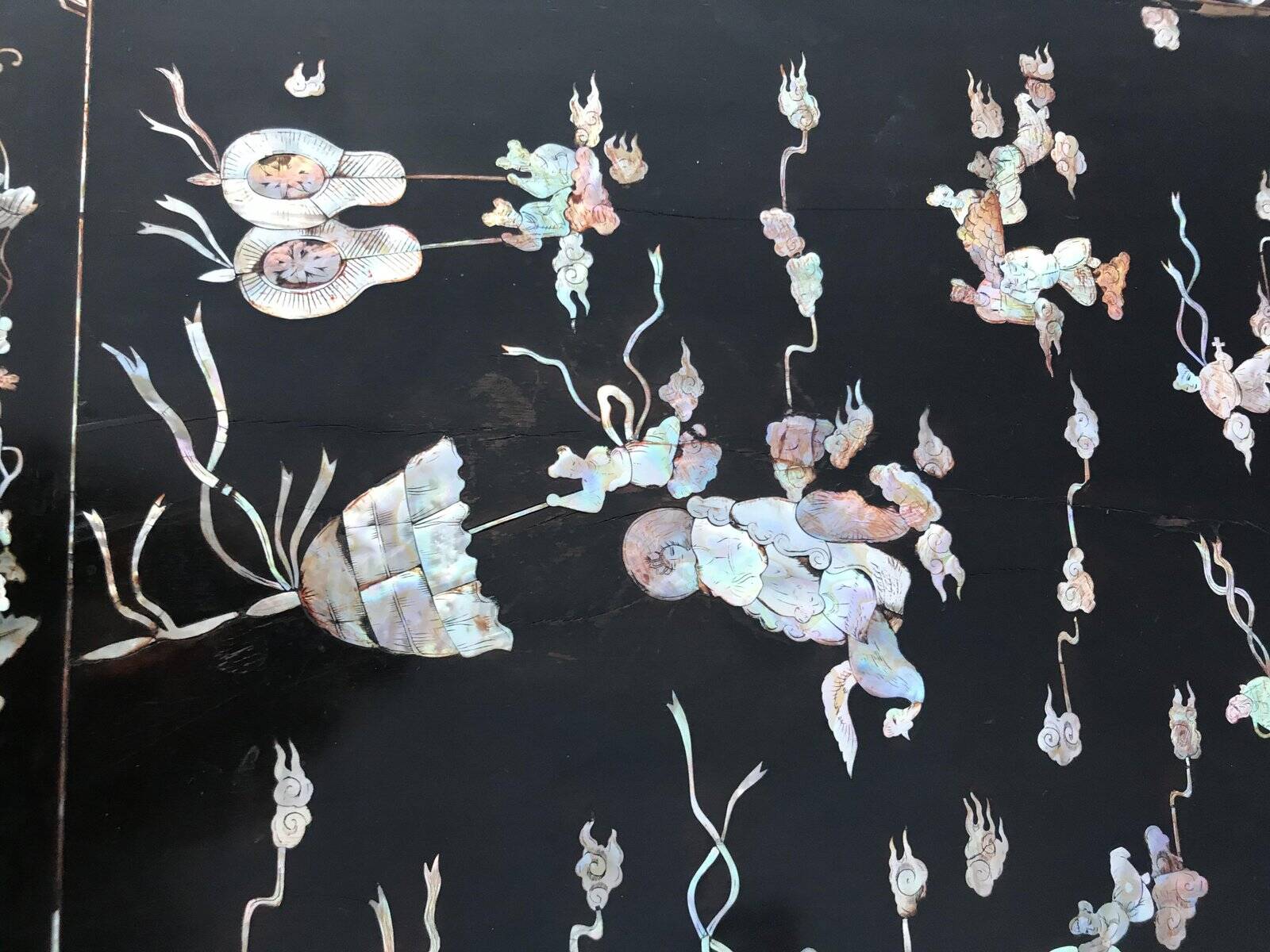 Chinese black lacquer side table with multicoloured inlays, 1950s.