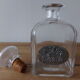 Glass and tin whiskey decanter