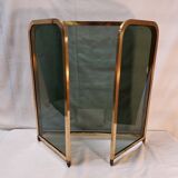Vintage fireplace screen in smoked glass and gold-tone metal