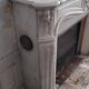 Louis XV style fireplace in veined white Carrara marble and XI ceramics.