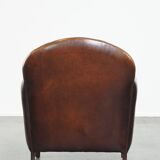 Characterful vintage design armchair made from beautifully patinated sheepskin